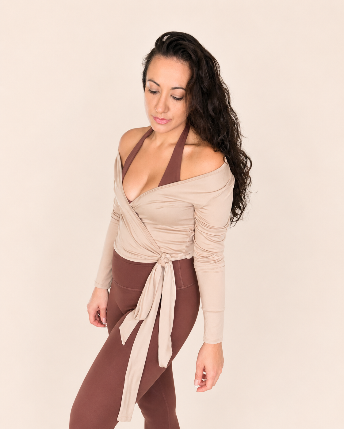 A lady wearing the contour sculpt wrap in beige