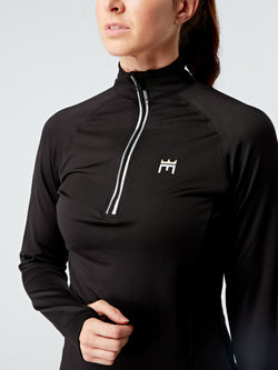 Alt=“ long sleeved half zip top will help you stay cool and dry. Engineered to wick sweat away from your body and keep you feeling light and comfortable during high-intensity exercise, this ultra-stretch fabric provides total freedom of movement with added thumb holes.  This top can be paired with your favourite leggings or for everyday wear. The extra bonus of a small pocket at the front of the top provides a secure place for your EarPod”