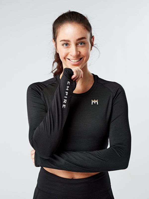 Alt=“The perfect long sleeve crop top for all you workouts and daily outfits!  Featuring:  Soft as can be, made from the same silky soft fabric as our Evolve Gold pocket leggings  Sweat wicking and fast drying  Cropped length   Coverage in all the right places  Thumb holes”