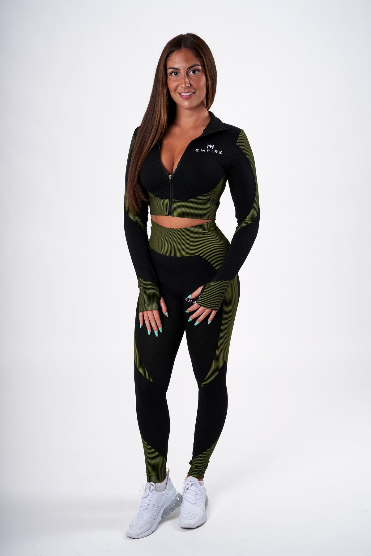 Alt=“black and green zipped crop top with honey comb fabric”