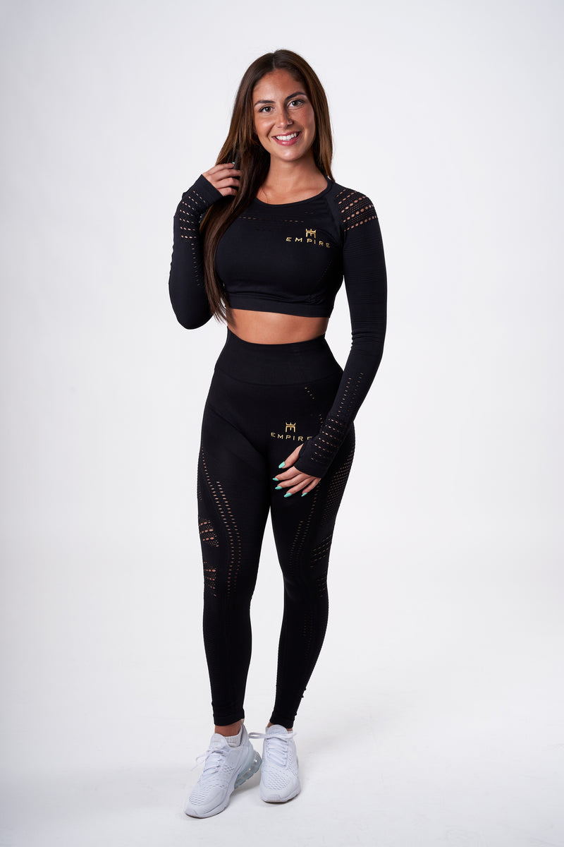 Alt=“black long sleeved crop top with mesh holes on shoulders and arms”